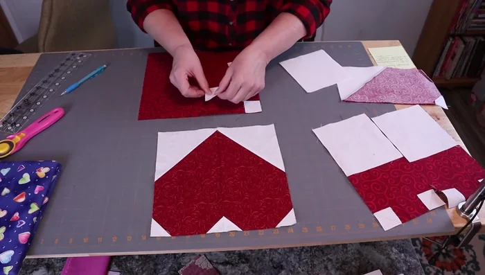 Sew and trim to create snowball corners, leaving 0.5 inch seam allowance for later use if desired.