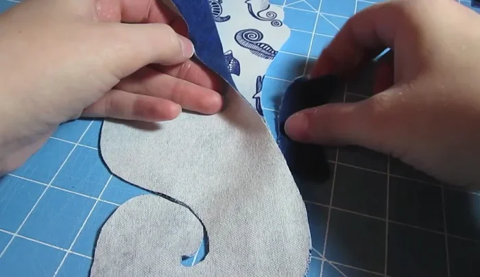 Sew the seahorse body: Place the fin inside the body pieces (right sides together) and pin, then sew around the perimeter leaving a 2-inch opening for turning.
