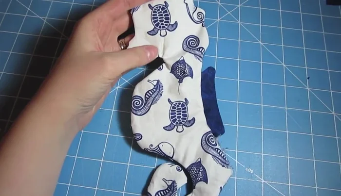 Turn the seahorse right side out and iron to remove wrinkles. Iron the opening down 1/4 inch.