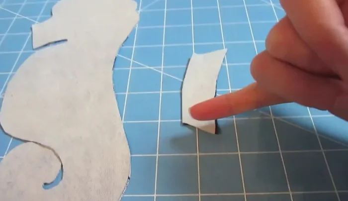 Sew the fins: Sew the two fin pieces together, leaving one side open for turning. Trim the corners for better turning.