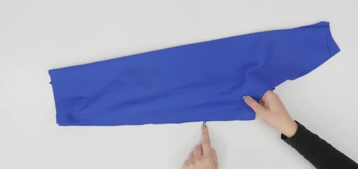 Trim the seam allowance close to the second stitch if using a double stitch and press towards the back.