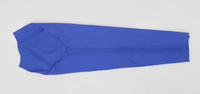 Trim the seam allowance close to the second stitch if using a double stitch and press towards the back.