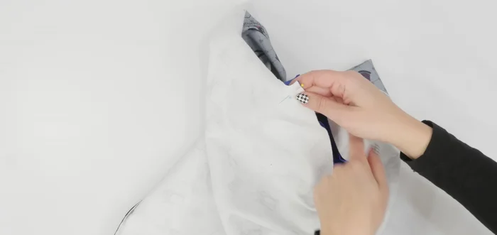 Sew the sleeve to the bodice using a double stitch. Trim the seam allowance.