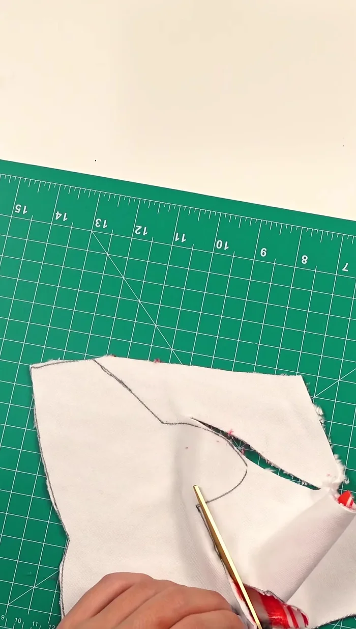 Cut out the shark pieces: two top pieces from the candy cane minky and one bottom piece from white minky.