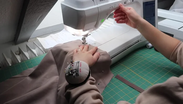 Insert the zipper: Sew the invisible zipper in place, stitching as close to the zipper teeth as possible. 