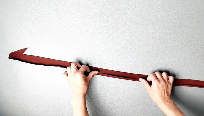 Prepare neck binding: Fold lower raw edge 3/8 inch, then top raw edge 3/8 inch. Sew short edges together with 5/8 inch seam allowance, press open. Fold in half, clip a small notch at the top.