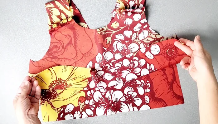 Place front and back bodice right sides together, pin side seams, and sew with a 5/8 inch seam allowance. Serge and press seams open.