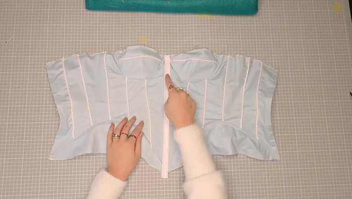 Add extra boning to the center front if needed to reduce wrinkles.