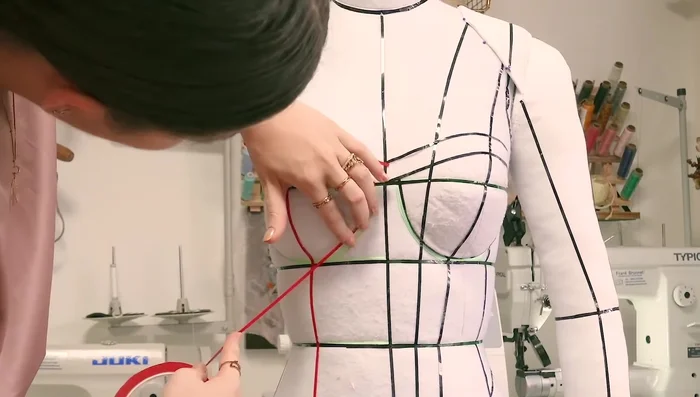 Add design lines as needed. Create a hemline, potentially adding a hip piece for comfort.