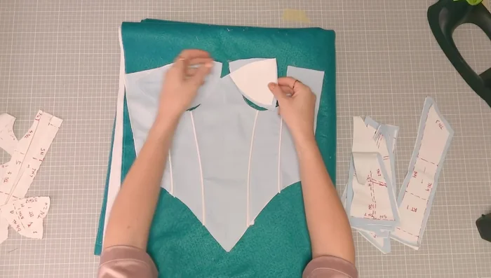 Assemble the cup pieces, sewing the triangular side seams together, then attaching the top piece with piping.