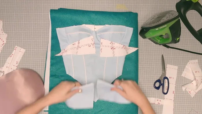 Sew and finish the hip pieces. Attach to the corset.