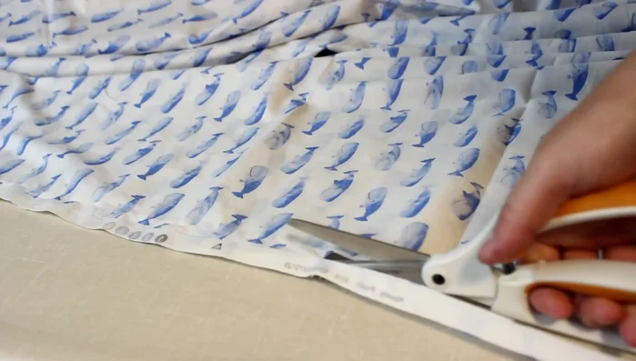 Cut off the seam allowance, leaving 1/4 inch. Finish the seam with a zig-zag stitch (a French seam is recommended for a neater finish).