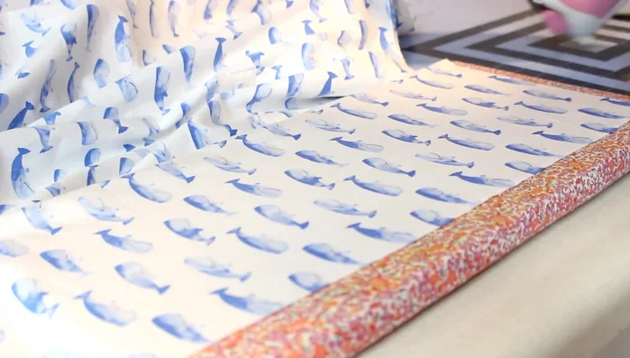 Hem the sides: Fold and press a 1/2 inch hem on each side, then fold and press again. Adjust to reach your desired width (typically 72 inches). Sew.