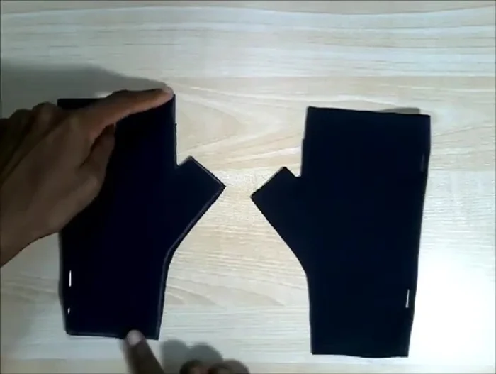 Sew the gloves: Sew the two pieces of each glove together using a 0.3cm seam allowance, leaving the top of the thumb area and the bottom open.