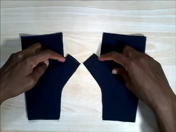 Clip curves and turn right side out: Trim the corners of your fabric to ease turning. Turn the gloves right-side out.
