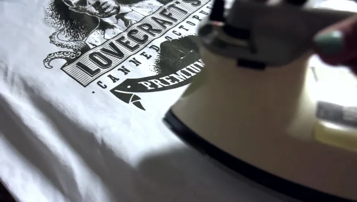 Carefully cut out the desired fabric shape, considering the placement of your design.