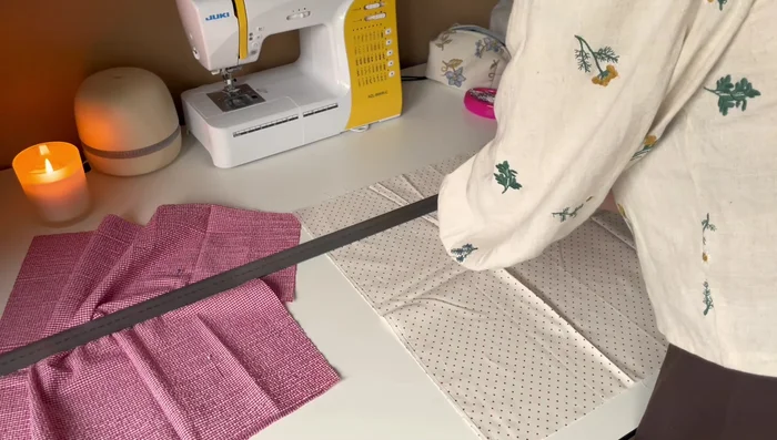 Cut out the fluffy quilting material slightly larger than the fabric squares to allow for mistakes and sliding during quilting.