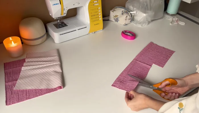 Cut out the fluffy quilting material slightly larger than the fabric squares to allow for mistakes and sliding during quilting.