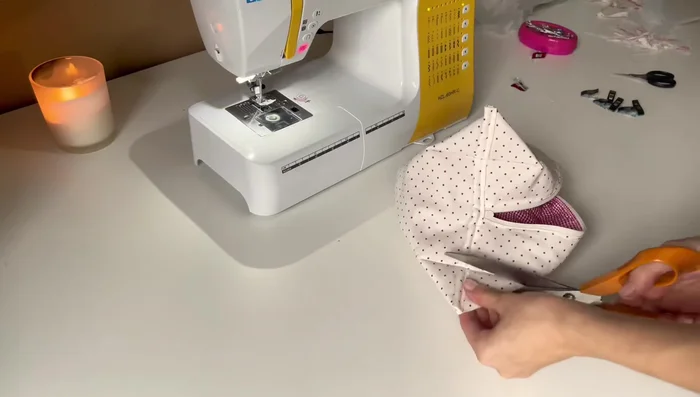 Finish the inside edges. Cut and sew a 5cm wide fabric strip to the inside edges of the pouch, encasing the raw edges for a clean finish.