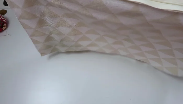 Finish the pillow: Unzip slightly to fit your hand in and tuck fringe/piping inward. Pin and stitch around the sides. Pop out the corners. If any tape is sticking out, pull it back in and stitch closer.