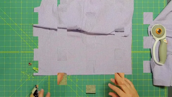 Fold and press the edges of the envelope backing to hide raw edges. Stitch along the folded edges to secure.