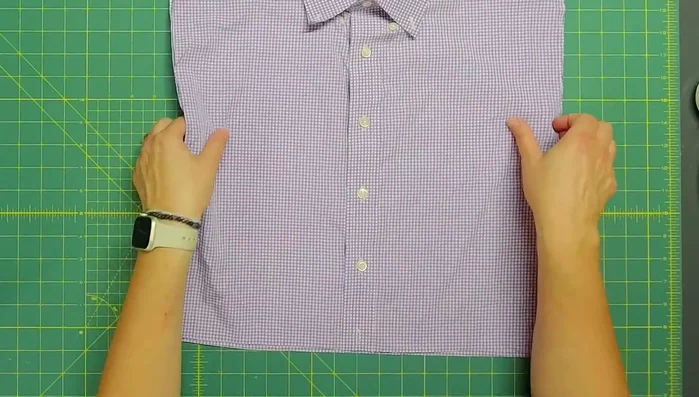 Cut the bottom piece of the shirt to create the second part of the envelope back. Fold and press the edges to hide raw edges and stitch down the edge to secure.