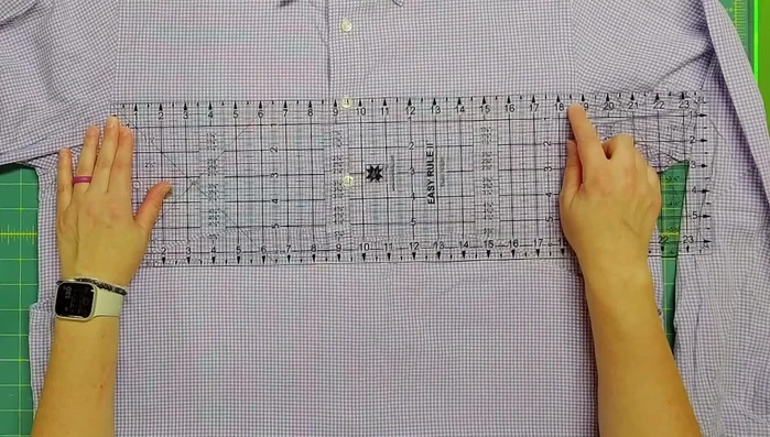 Measure the shirt's width to determine the pillow's width. Cut along the sleeve seams to create a rectangular front piece.