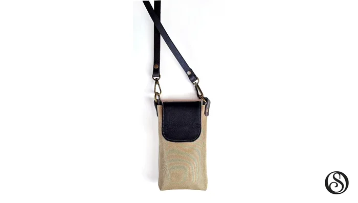 Employ the ingenious folding and stitching technique to create the firm back spine, adding strength and structure to the bag while forming a slip pocket.