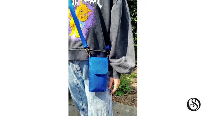 Construct the slip pocket on the back, the secret inner card pocket, and the second credit card pocket inside the bag.