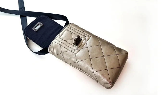 Attach the magnetic snap or twist lock closure to the strengthened areas on the bag.