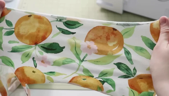 Cut the fabric: Cut two mirrored front pattern pieces, two mirrored back pattern pieces, and the waistband on the fold. Add seam allowances (if not included in your pattern).