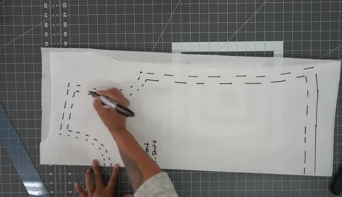 Cut out the front pattern piece: Cut along the outer lines of your marked pattern, creating a full front pattern piece.