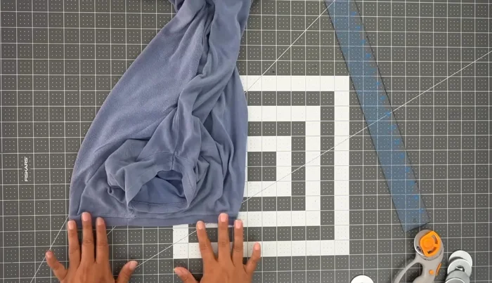 Create the neckband: Measure the neckline of the front pattern piece and add 1/4 inch for seam allowance. Create a rectangle that's twice the neckline length and 2 inches wide. Cut it out.