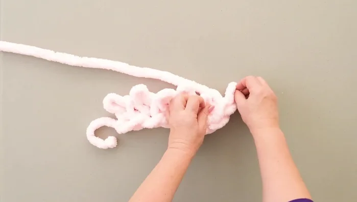 Knit until the scarf reaches the desired length.