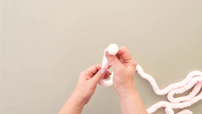 Make a knot and cut the yarn end to prevent unraveling.