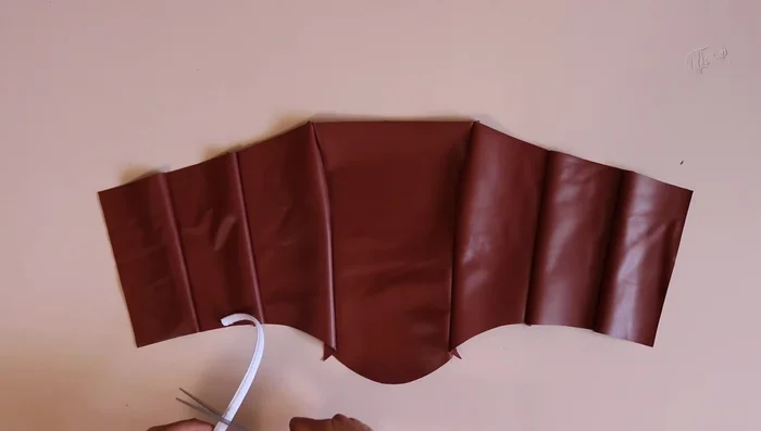 Prepare boning casing, cut to seam size, and sew onto the corset seams. Insert boning.