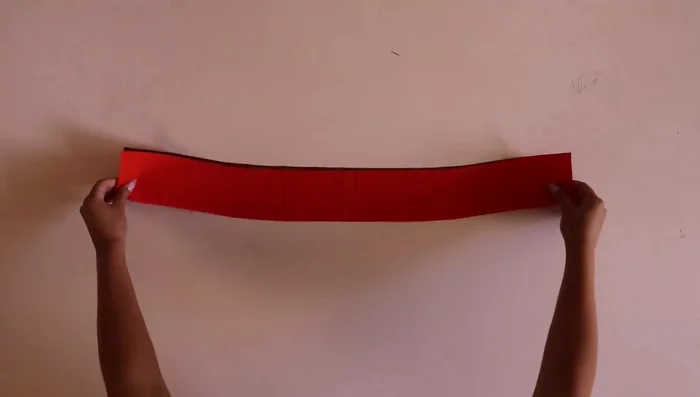 Attach neckline band to corset shell and lining, sew, trim, and press.