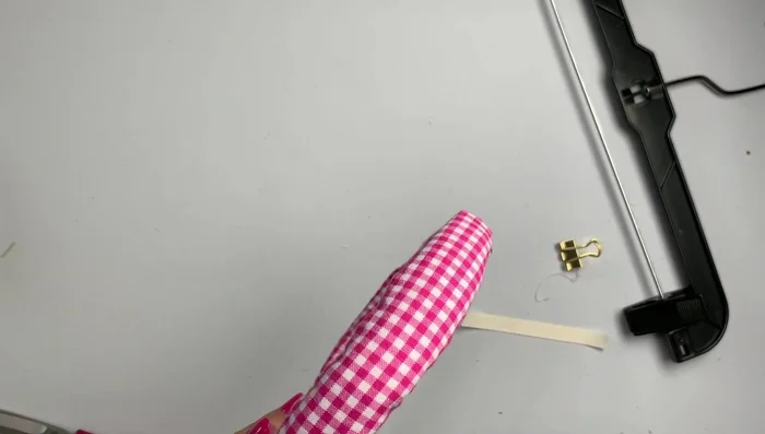 Remove clips and trim excess twill tape.