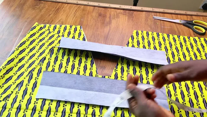 Cut two pieces of fabric (approximately 15 inches long and 3.5 inches wide). Adjust width as needed.