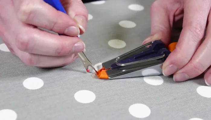 Make bias tape: Feed 2in strips through bias tape maker and iron.