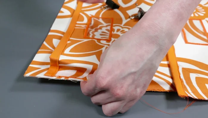 Sew side seams: Align diagonal edges and sew down the sides of the pockets, close to the edge.