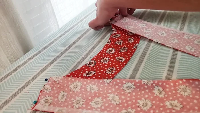 Sew the front and back bodice pieces together at the shoulder seam using a French seam.