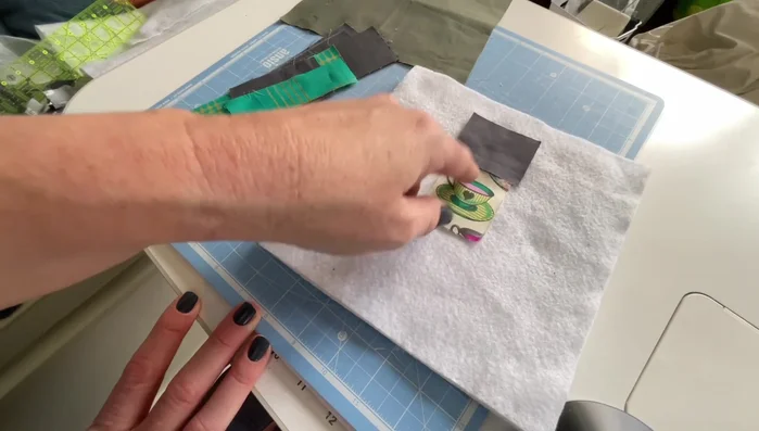 Flip and top stitch. After sewing each strip, flip it open and top stitch along the seam to secure it. Use a consistent stitch length (the tutorial uses 3) to save time.