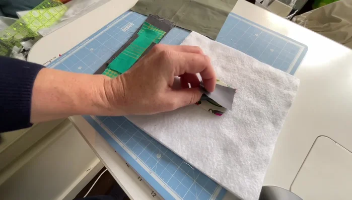 Flip and top stitch. After sewing each strip, flip it open and top stitch along the seam to secure it. Use a consistent stitch length (the tutorial uses 3) to save time.