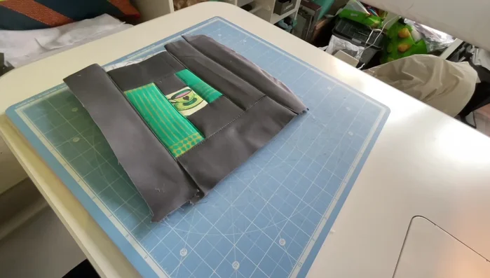 Trim the quilted top. Once all strips are sewn, trim the edges of the quilted top to your desired size (approximately 7.5 inches square).