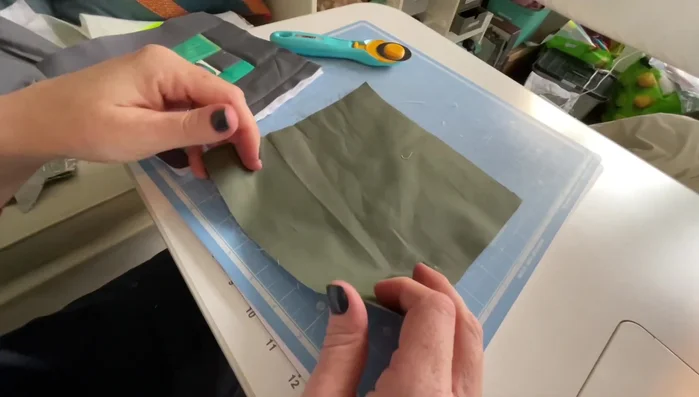 Attach the backing. Place the backing fabric right side down onto the quilted top. Sew around the edges with a scant 1/4 inch seam allowance. Trim excess backing.