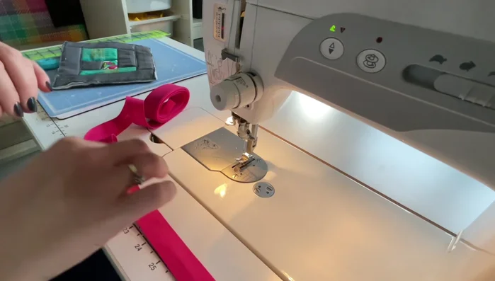 Create hanging loops. Cut a 5-inch length of bias binding. Fold it in half lengthwise and sew along the long edge to create a loop. Set aside.