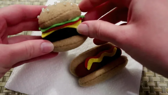 Add optional details to the hamburger, such as beads for sesame seeds.