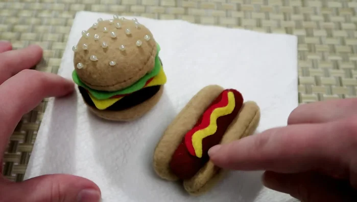 Optional: Embellish the hot dog with additional details, such as relish or chili.