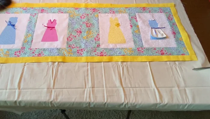 Prepare Quilt Sandwich: Cut backing fabric and batting slightly larger than the table runner. If using multiple pieces of batting, carefully sew them together with a zigzag stitch.